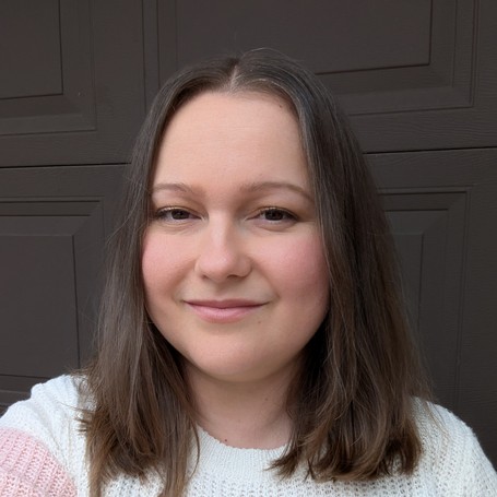 Risa Kerslake, a registered nurse, looking into the camera